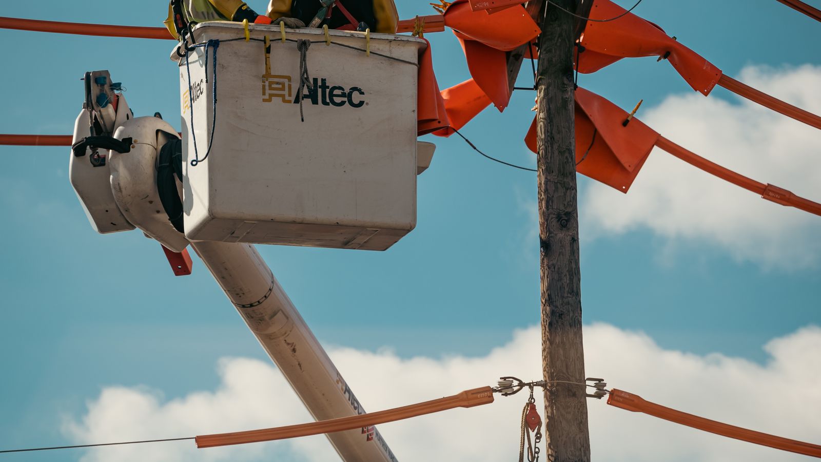 Utility line worker operating from a service vehicle