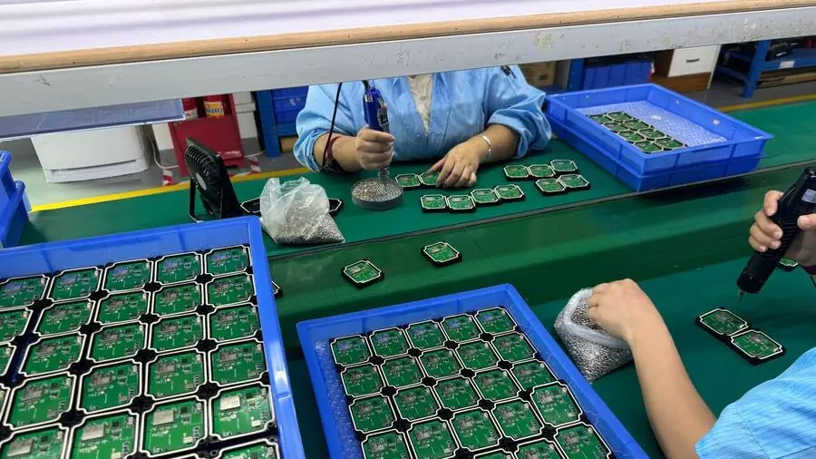 GPS tracker boards being assembled at a Shenzhen partner facility